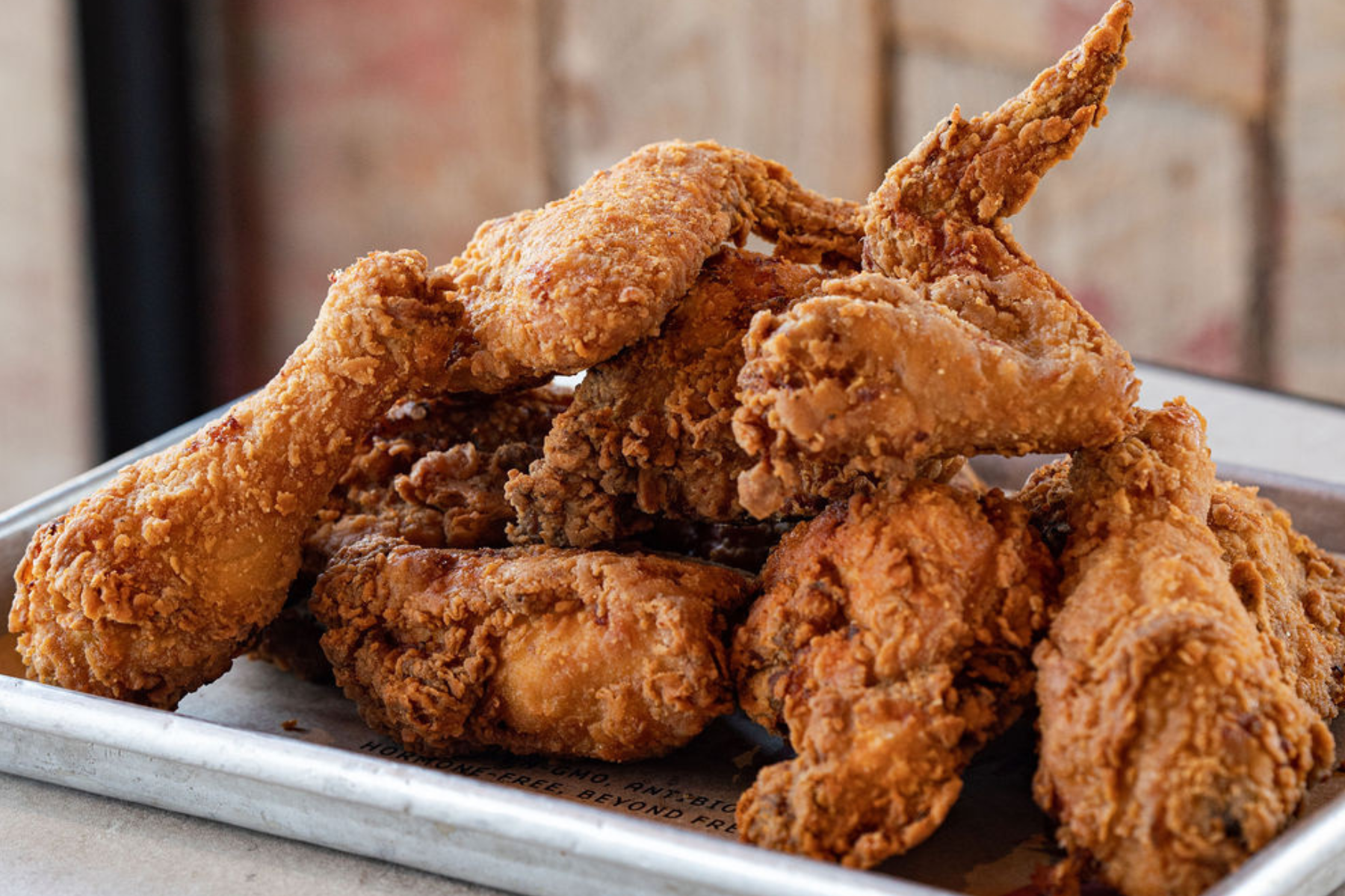 Bone in fried chicken on a tray