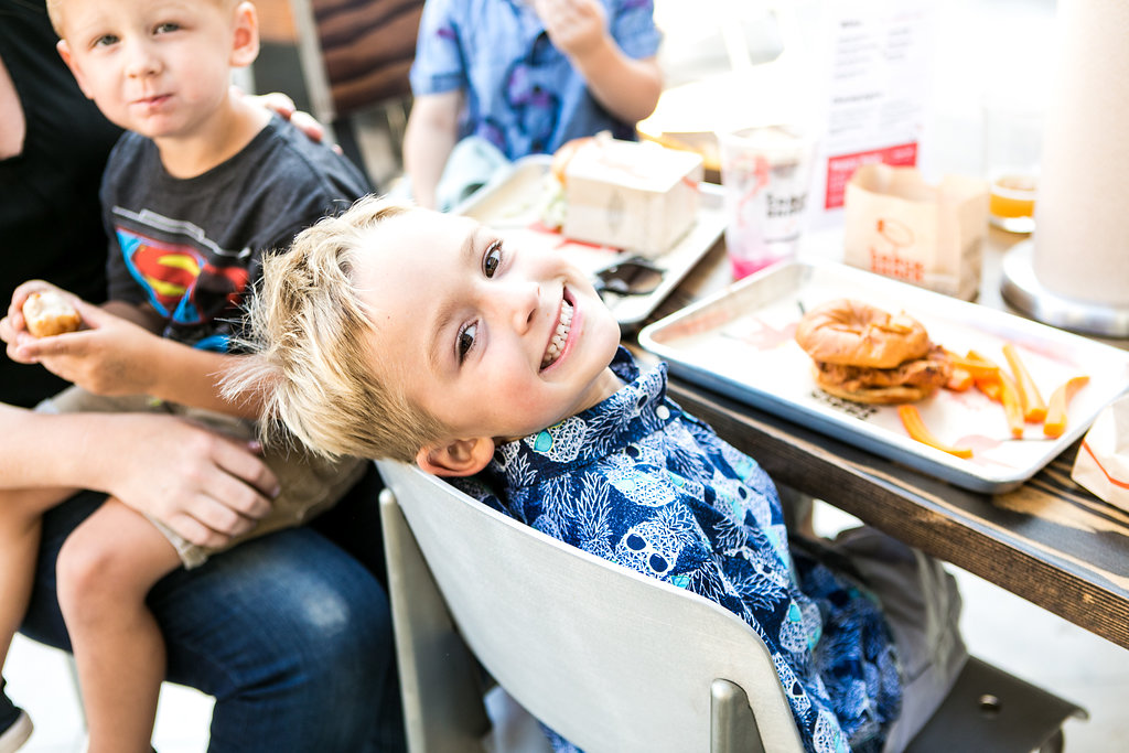 Young family eating kids meal at a restaurant