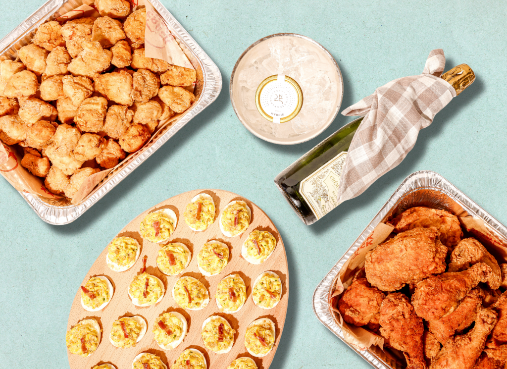 Golden Egg Package: deviled eggs, nuggets, bone-in, caviar and more on a blue background.