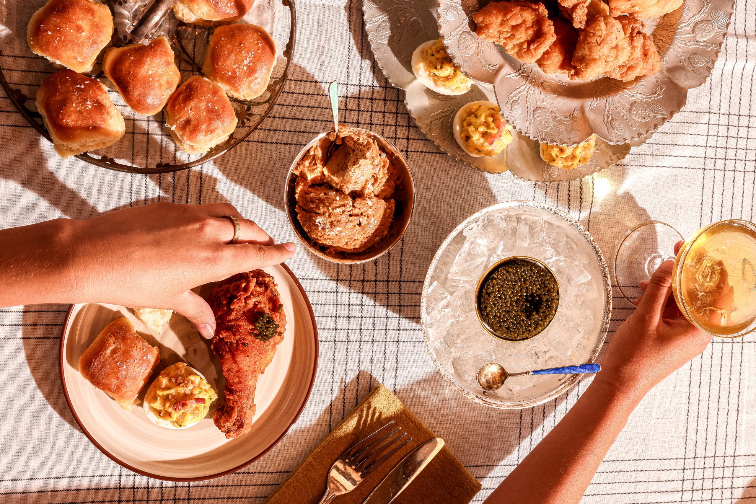 Catering chicken, biscuits, and deviled eggs with caviar.