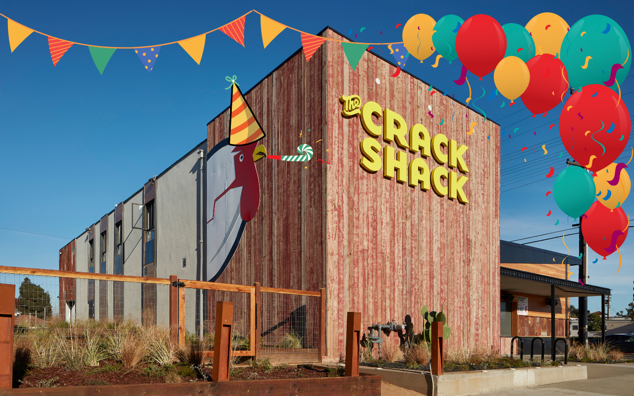 The Crack Shack building in Costa Mesa with balloons and decoration graphics on it.